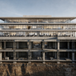 “Modern office building with visible underground foundations, showing structural infrastructure beneath a working office environment.