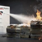 Illustration showing a PPC audit report extinguishing burning stacks of ad budget, symbolising how PPC audits eliminate wasted advertising spend.